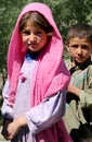 Two children pose for photos at a nomad settlement in central Afghanistan