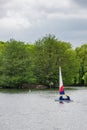 Two children practice sailing on a Spring day in South Norwood l