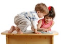 Two children reading the book on the desk Royalty Free Stock Photo