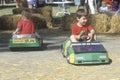 Two children riding solar powered minature cars, Willits, CA Royalty Free Stock Photo