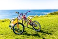 Two children`s bicycles parking on the seaside on a sunny day.