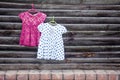 Two children`s dresses for girls on hangers Royalty Free Stock Photo