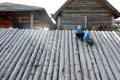 Two children sitting on wall of viking fortress