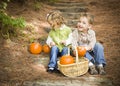 Two Children Sitting on Wood Steps with Pumpkins Royalty Free Stock Photo