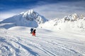 Two children are skiing on mountain piste in French Alps Royalty Free Stock Photo