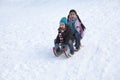 Two children on a sled having fun Royalty Free Stock Photo