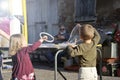 Two children in the square blowing soap bubbles and having fun