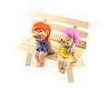 Two children statue to happy and smile , sitting on the wooden c Royalty Free Stock Photo