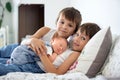 Two children, toddler and his big brother, hugging and kissing t Royalty Free Stock Photo