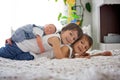 Two children, toddler and his big brother, hugging and kissing t Royalty Free Stock Photo