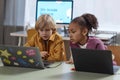 Two Children Using Laptop Computers in Class Royalty Free Stock Photo