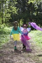 Two children walking along a woodland path Royalty Free Stock Photo