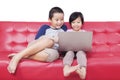 Two children watching movie together with laptop Royalty Free Stock Photo