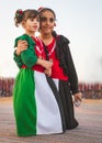 Two children wear national UAE dress