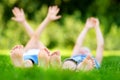 Two childrens feet on grass outdoors in a park Royalty Free Stock Photo