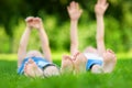 Two childrens feet on grass outdoors Royalty Free Stock Photo