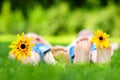 Two childrens feet on grass outdoors