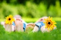 Two childrens feet on grass outdoors Royalty Free Stock Photo