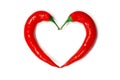 Two chili peppers forming a shape of heart