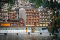 Women posing on a wooden bridge path over Tuo Jiang river in Feng Huang