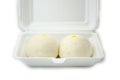 Two Chinese steamed buns in white box isolated on white background Royalty Free Stock Photo