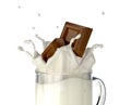 Two chocolate blocks falling into a glass mug full of fresh milk. Royalty Free Stock Photo