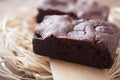 Two chocolate brownies stacked on wood Royalty Free Stock Photo