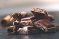 Two chocolate buildings on a dark background. energy and sugar. Broken bar. Chocolate blocks stack