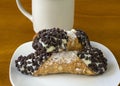 Two chocolate chip cannolis with coffee Royalty Free Stock Photo
