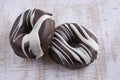 Two chocolate covered donuts Royalty Free Stock Photo