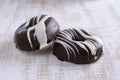 Two chocolate covered donuts Royalty Free Stock Photo