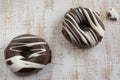 Two chocolate covered donuts Royalty Free Stock Photo