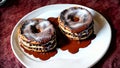 Two Chocolate Covered Donuts Sitting On Top Of A White Plate. Generative AI Royalty Free Stock Photo