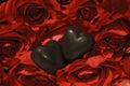 Two chocolate hearts and ruby red roses Royalty Free Stock Photo