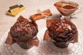 Two chocolate muffins with hot chocolate