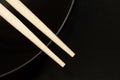 Two chopsticks on a black bowl Royalty Free Stock Photo