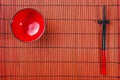 Two chopsticks on sushi mat Royalty Free Stock Photo