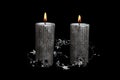 Two Christmas silver candles on the black background Royalty Free Stock Photo