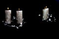 Two Christmas silver candles, reflection in mirror Royalty Free Stock Photo