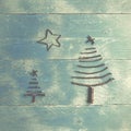 Two Christmas trees and star made from dry sticks on wooden, blu Royalty Free Stock Photo