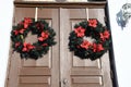 Christmas wreaths on the doors to an old church Royalty Free Stock Photo