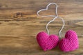 Two chrocheted hearts with threads Royalty Free Stock Photo