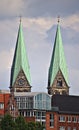 Two church spires over city skyline Royalty Free Stock Photo