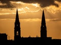 Two Church Spires Silhouette on a Golden Sunset, Ireland Royalty Free Stock Photo