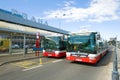 Two city buses at the bus stop near the Terminal 1 of the Vaclav Havel airport. Prague, Czech Republic Royalty Free Stock Photo