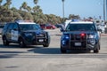 Two City of Ventura Police Departement SUVs at the scene of an arrest at Ventura Harbor