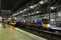 Two class 185 dmu trains in Leeds station at night