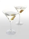 Two classic dry martini with olives on white background Royalty Free Stock Photo