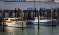 Classic Motor Boats in front of a super yacht Viaduct Harbour, Auckland New Zealand Royalty Free Stock Photo