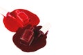 Two classic red nail polish - open bottles with spilled product